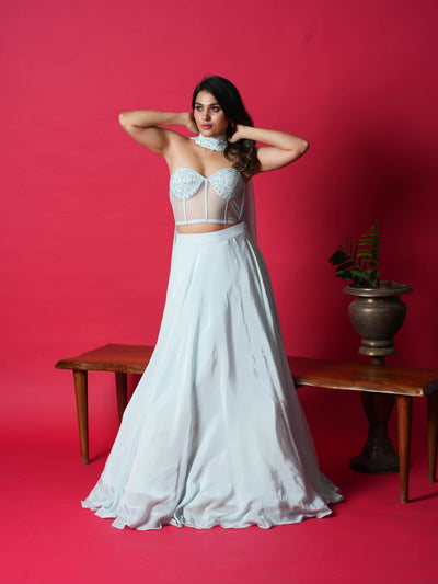 JULIE-The Corset Crop top features stunning handwork on the top, while the skirt and dupatta add an elegant touch. Made with premium Italian Crepe, it's available in four gorgeous colors.