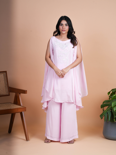 Our AROHA kaftan set with the open slit sleeves and delicate handwork with cutdana n pearls. Its premium Italian crepe outfit. Complete with a bottom sharara.