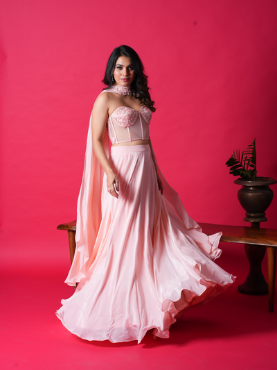 JULIE-The Corset Crop top features stunning handwork on the top, while the skirt and dupatta add an elegant touch. Made with premium Italian Crepe, it's available in four gorgeous colors.