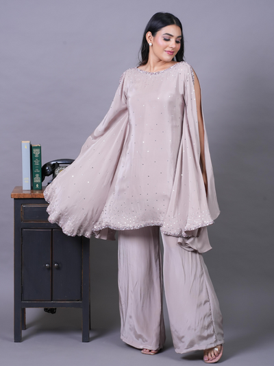 MIRA-Slit Sleeves Sequence Work Top! Made from premium Italian Crepe, this kaftan comes with a straight plazo and delicate sequence work on the top and sleeves. Available in three pastel colours.