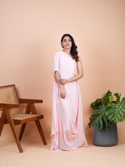 Our ALAYA one shoulder gown. Featuring delicate handwork from the neck to the shoulder .The full-length outfit with a caul in the bottom. Available in four stunning pastel colors.Its a premium Italian crepe.